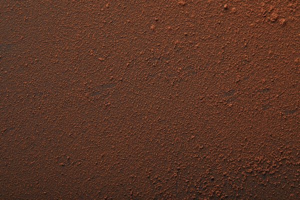 полная рамка вкусного какао порошка на поверхности
