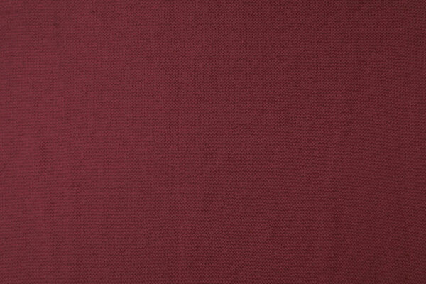close up view of burgundy woven fabric texture  