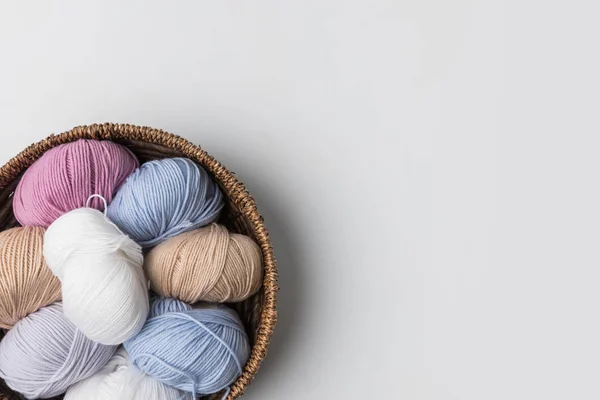Top view of colored yarn balls in wicker basket on white background — Stock Image Top View Colored Yarn Balls Wicker Basket White Background Stock Picture
