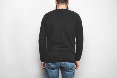 back view of man in black sweatshirt isolated on white clipart