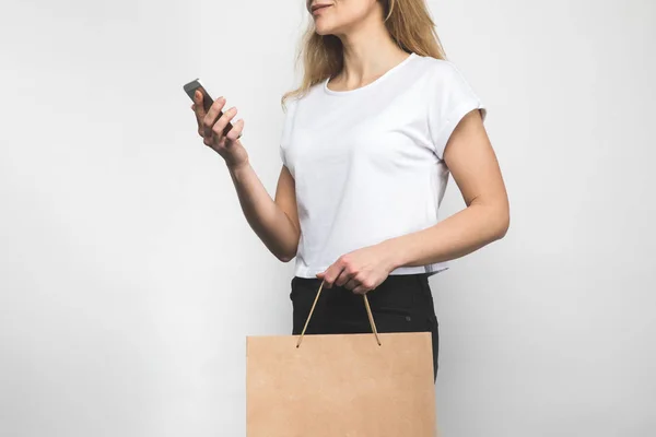 Cropped Shot Woman Blank Shirt White Shopping Bag Smartphone — Stock Photo, Image