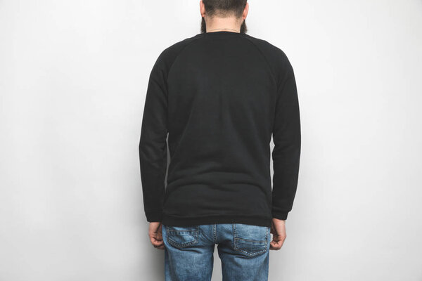 back view of man in black sweatshirt isolated on white