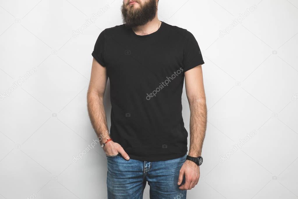 Cropped shot of man in black t-shirt isolated on white