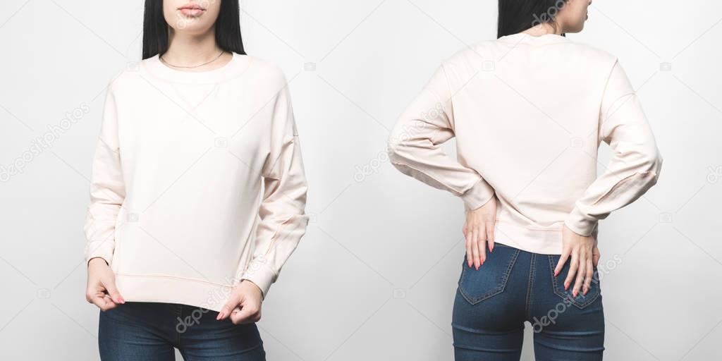 front and back view of young woman in blank sweatshirt isolated on white