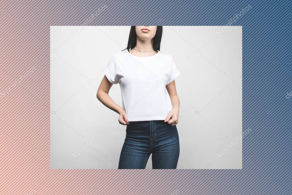 young woman in blank t-shirt on white with creative frame