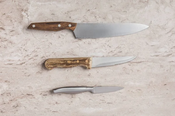 Top View Three Different Knifes Marble Tabletop — Stock Photo, Image