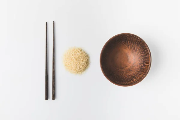 Top View Raw Rice Heap Bowl Chopsticks Isolated White — Stock Photo, Image