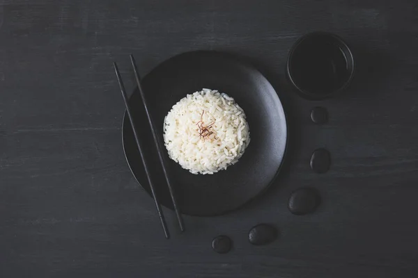 Top View Tasty Rice Plate Chopsticks Black Table — Stock Photo, Image