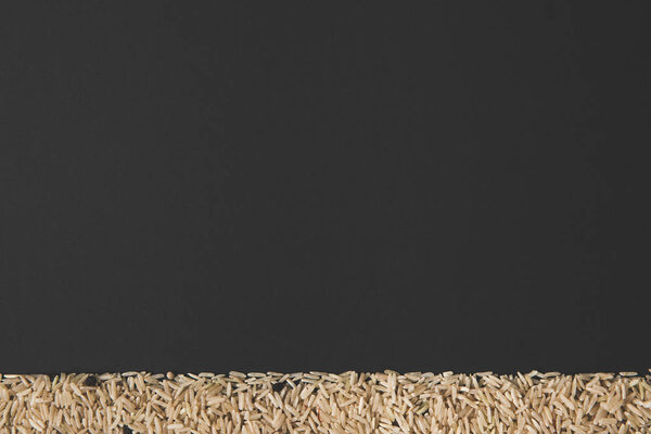 raw rice isolated on black with copy space