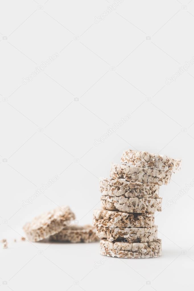 stack of crispy rice cakes on white tabletop