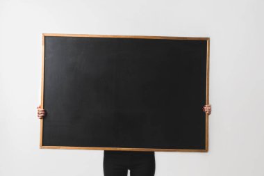woman holding big empty black board isolated on white