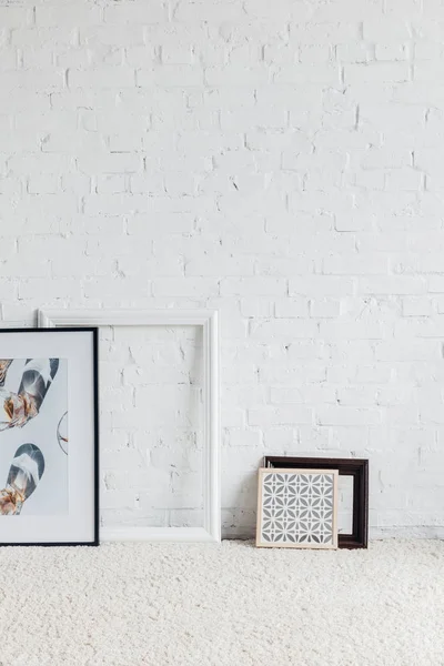 Pictures Frames Leaning White Brick Wall Mockup Concept — Stock Photo, Image