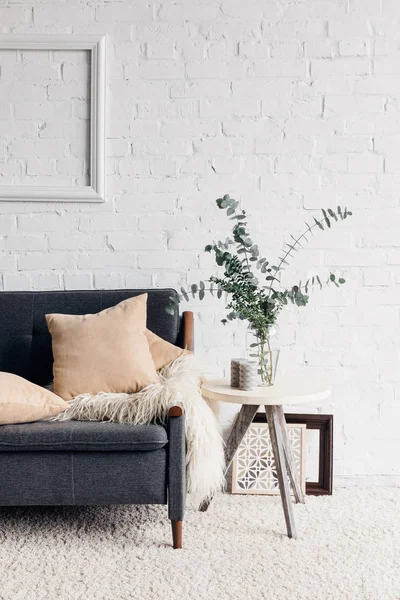 Modern living room interior with cozy couch and flower in pot on table, mockup concept — Stock Image Modern Living Room Interior Cozy Couch Flower Pot Table Mockup Stock Image