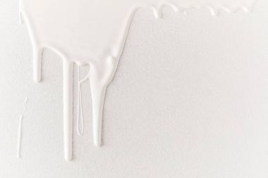 white dripping paint on white surface clipart