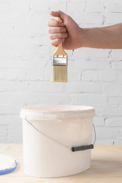 Cropped Image Man Holding Brush White Paint Bucket — Stock Photo, Image