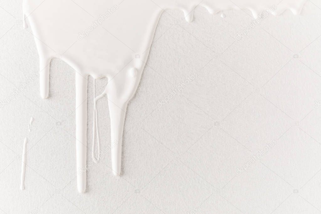 white dripping paint on white surface