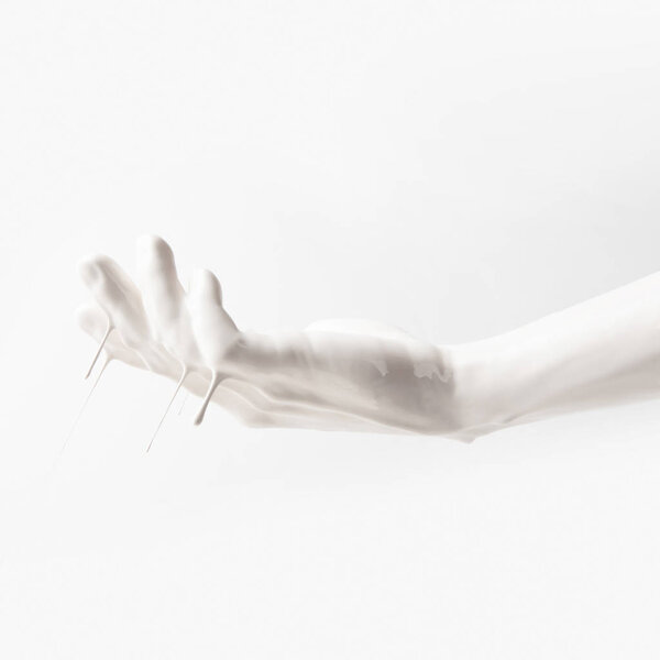 cropped image of woman in white dripping paint isolated on white