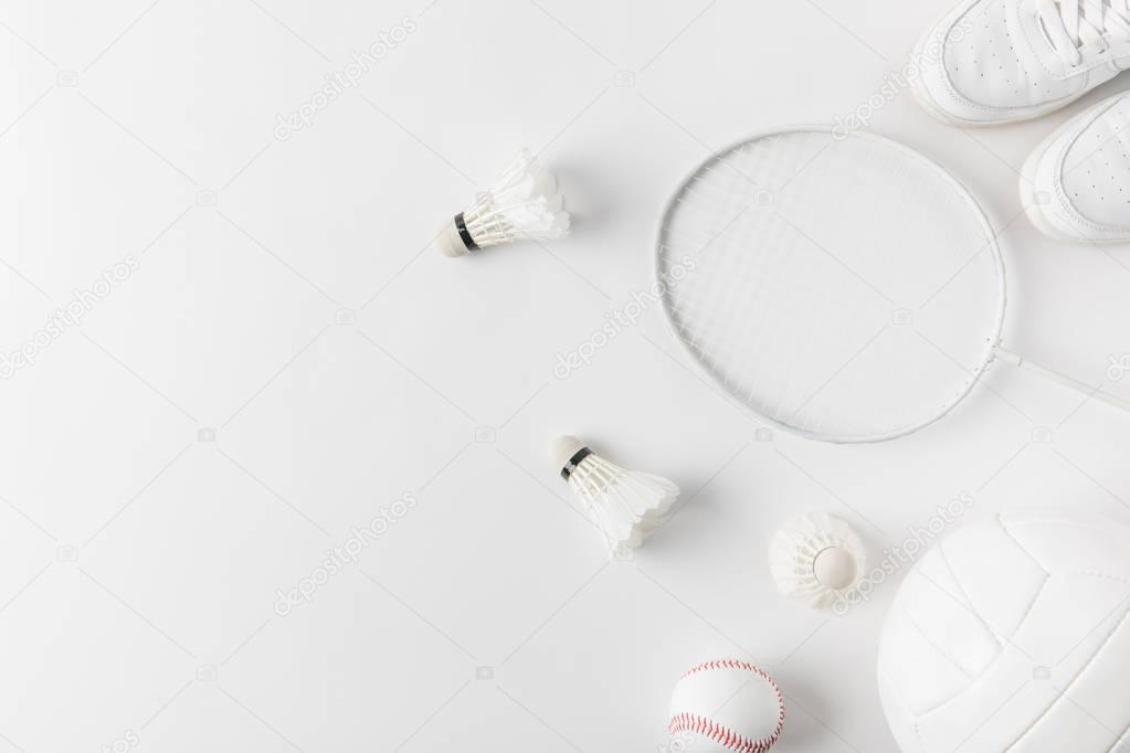 different sports equipment on white surface