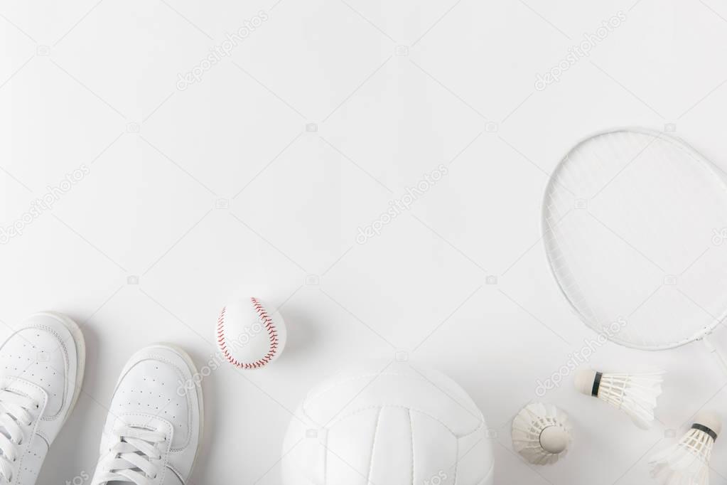 various sports equipment on white surface
