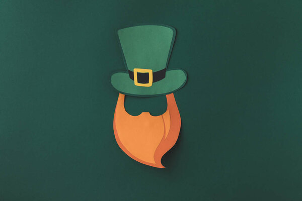 top view of paper decoration of man in green hat for st patricks day isolated on green