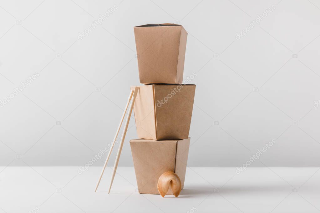 noodles boxes with chopsticks and chinese fortune cookie