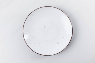 Top view image of plate placed on white surface, minimalistic conception clipart
