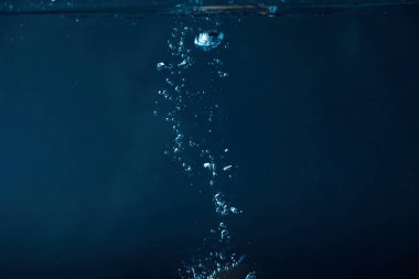 full frame of dark water with bubbles background clipart