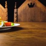 Close-up view of tasty caesar salad on wooden table