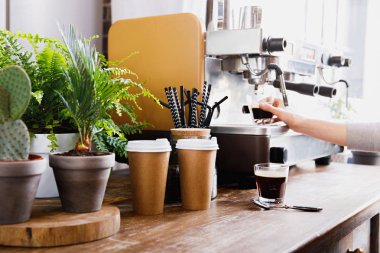 Close-up view of bartender preparing coffee on modern espresso machine clipart