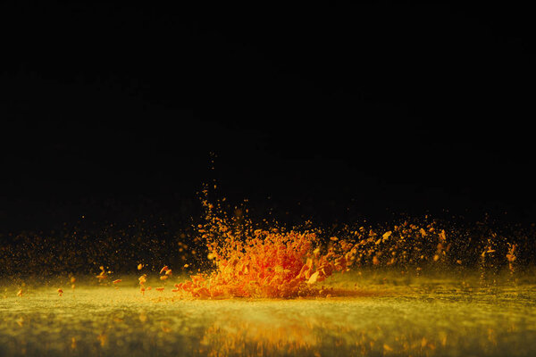yellow holi powder explosion on black, Hindu spring festival