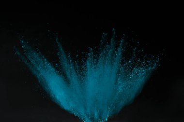 blue holi powder explosion isolated on black, Hindu spring festival clipart
