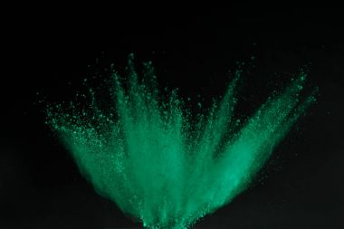 green holi powder explosion isolated on black, Hindu spring festival clipart