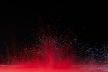 red holi powder explosion on black, traditional festival of colours clipart
