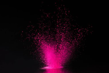 pink holi powder explosion on black, traditional Indian festival of colours clipart