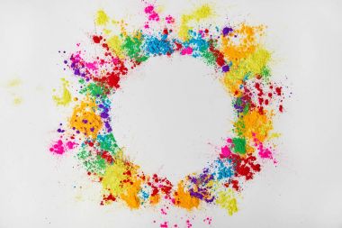 circle frame of multicolored traditional powder, isolated on white, festival of colours clipart