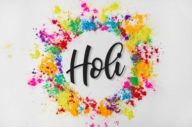 circle frame of colorful traditional paint with Holi sign, isolated on white, Hindu spring festival of colours clipart