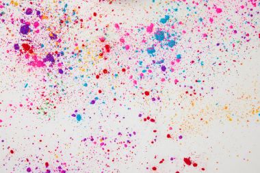 top view of scattered colorful holi powder isolated on white clipart