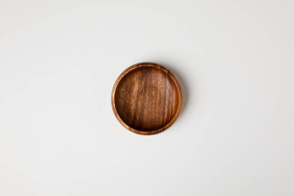 top view of wooden bowl isolated on white