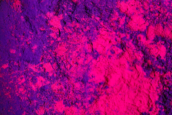 top view of purple and pink holi powder, traditional Indian festival of colours