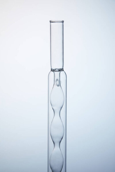 close-up shot of empty chemistry flask on grey