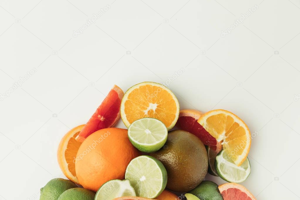 Raw cut citruses isolated on white background