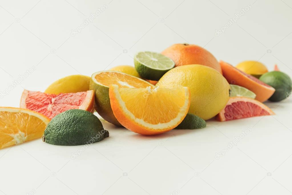 Pile of juicy citruses isolated on white background