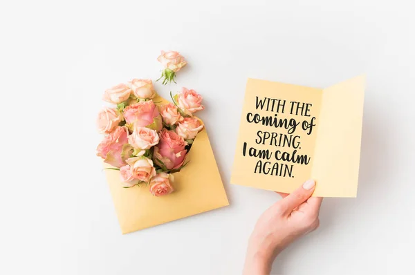 Hand Holding Paper Spring Quote Pink Flowers Envelope Isolated White — Stock Photo, Image