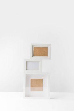 empty white photo frames stacked on white clipart