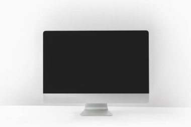 modern desktop computer with black screen on white clipart