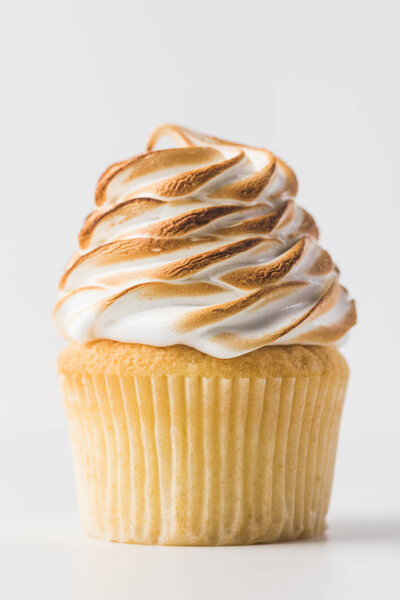 close up view of sweet cupcake with meringue isolated on white