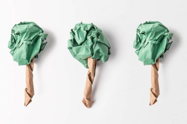 top view of paper made green trees isolated on grey, recycling and environment protection concept clipart