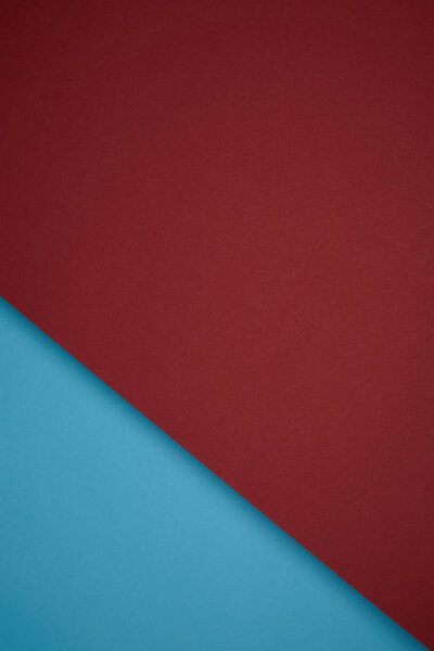 creative geometric background from red and blue colored paper
