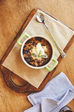 Cobbler pie in pot served on cutting board clipart