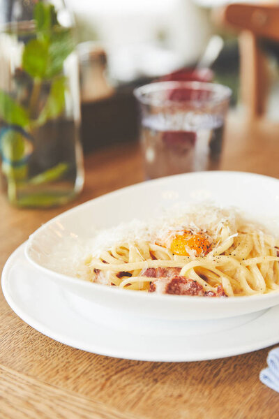 Close-up view of carbonara pasta in white plate